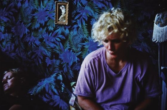 Nan Goldin, 1989, “Sharon with Cookie on the bed, Provincetown”